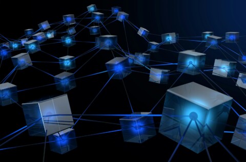 Futuristic digital blockchain network showing interconnected transparent cubes linked by glowing blue lines, representing decentralized autonomous startups and blockchain technology.