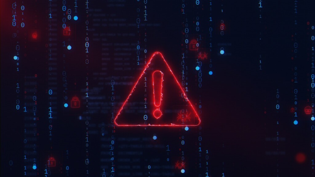 Digital cybersecurity warning symbol with red glowing exclamation mark overlayed on binary code background representing deepfake cyber attacks in 2025