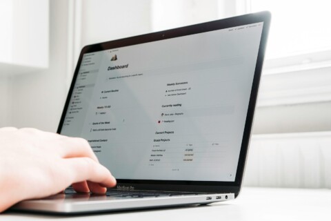User interacting with a vertical SaaS solution dashboard on a laptop in 2025