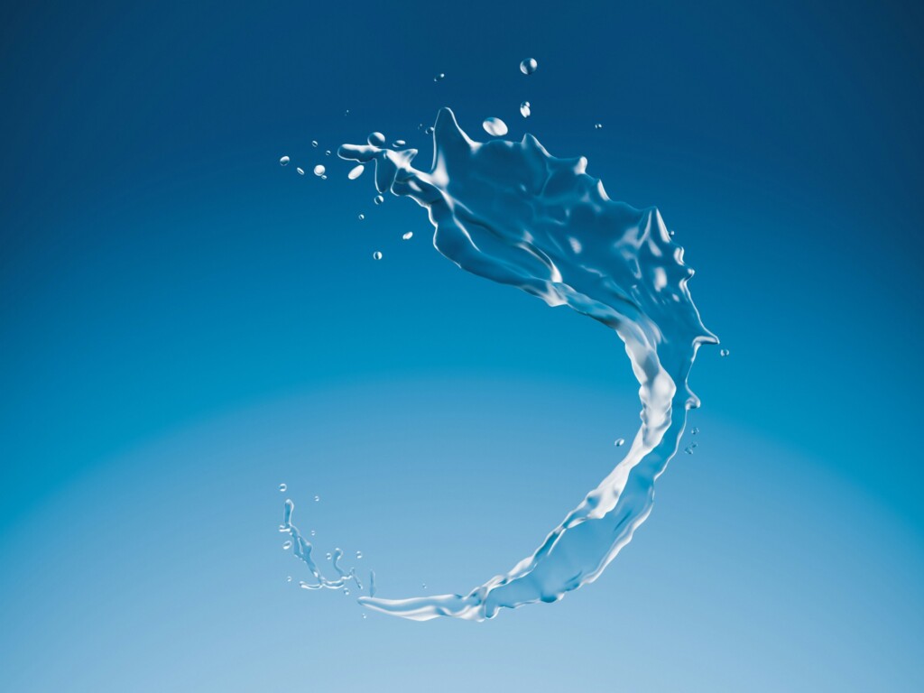 Splash of water forming an arc against a blue background, symbolizing natural energy flow and sustainable osmotic power for technology and device innovation.