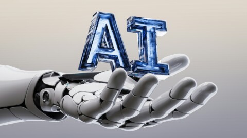 A futuristic robotic hand holding the letters 'AI', symbolizing artificial intelligence and ethical technology.